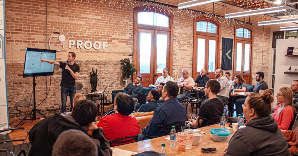 Man giving a presentation to colleagues in an office workspace